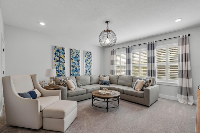 carpeted living room featuring a textured ceiling, baseboards, and recessed lighting