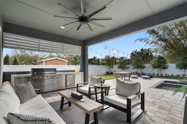 view of patio / terrace with an outdoor kitchen, a fenced backyard, a grill, outdoor lounge area, and outdoor dining space