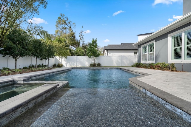 view of swimming pool with an in ground hot tub, a patio area, a fenced backyard, and a fenced in pool