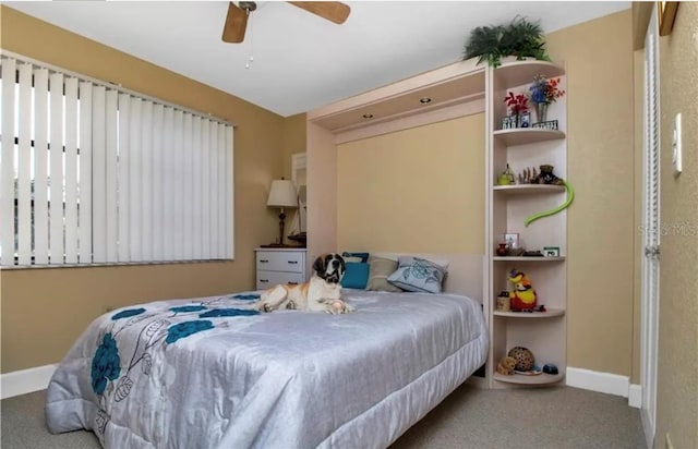 bedroom with carpet floors, baseboards, and a ceiling fan