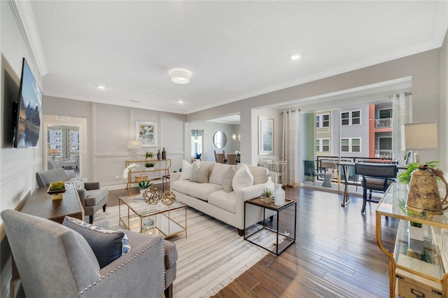 living area with recessed lighting, crown molding, and wood finished floors