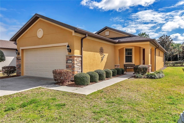 ranch-style house featuring an attached garage, stone siding, driveway, stucco siding, and a front yard