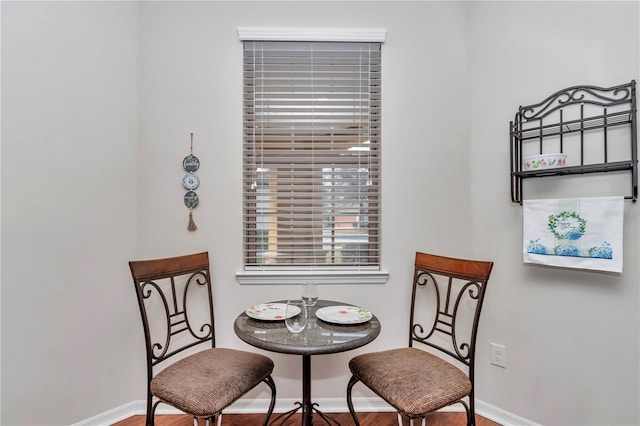 living area featuring baseboards