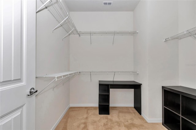 walk in closet featuring carpet floors and visible vents