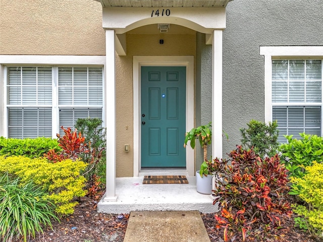 1410 Stockton Dr, Sanford, FL 32771 - doorway to property featuring stucco siding