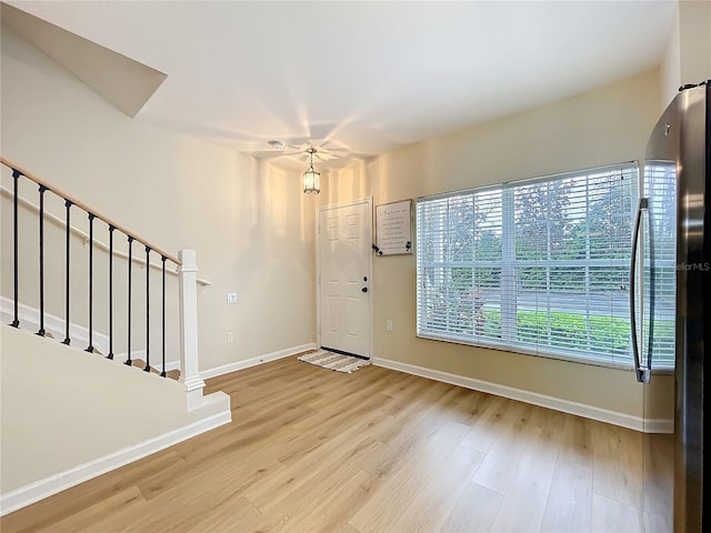 1410 Stockton Dr, Sanford, FL 32771 - entryway with wood finished floors, baseboards, and stairs
