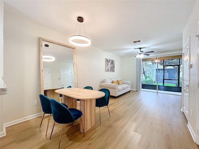 1410 Stockton Dr, Sanford, FL 32771 - dining room featuring light wood-style floors, visible vents, baseboards, and a ceiling fan