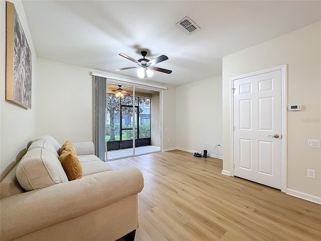 1410 Stockton Dr, Sanford, FL 32771 - living area with visible vents, baseboards, light wood-style flooring, and a ceiling fan
