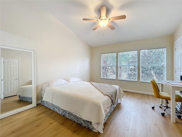 1410 Stockton Dr, Sanford, FL 32771 - bedroom with light wood-type flooring, vaulted ceiling, baseboards, and ceiling fan