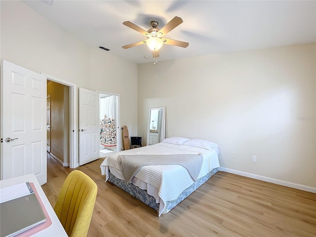 1410 Stockton Dr, Sanford, FL 32771 - bedroom featuring visible vents, vaulted ceiling, ceiling fan, light wood-type flooring, and baseboards