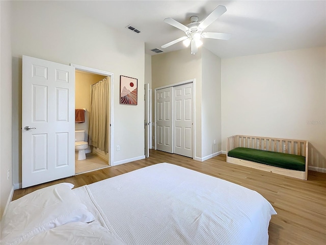 1410 Stockton Dr, Sanford, FL 32771 - bedroom with a closet, wood finished floors, visible vents, and baseboards
