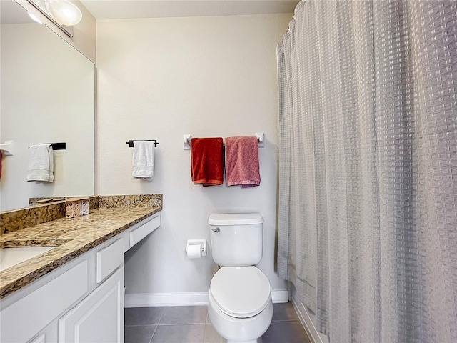 1410 Stockton Dr, Sanford, FL 32771 - full bathroom featuring toilet, vanity, baseboards, and tile patterned floors