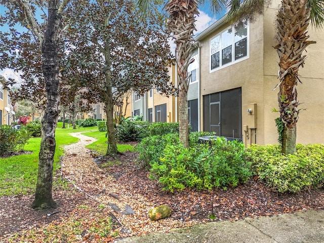 1410 Stockton Dr, Sanford, FL 32771 - view of home's exterior with a yard and stucco siding
