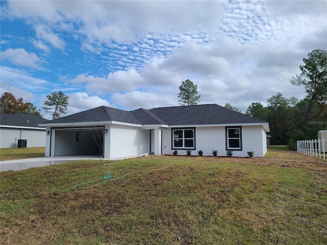 ranch-style house with a garage, driveway, a front lawn, and stucco siding