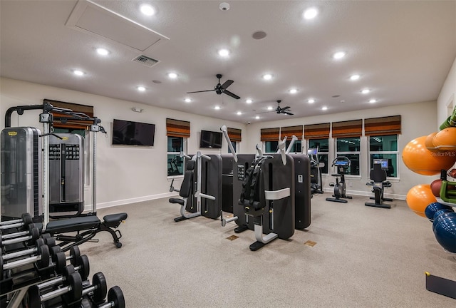 exercise room featuring ceiling fan, recessed lighting, carpet flooring, visible vents, and baseboards