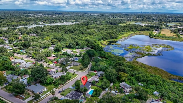 bird's eye view featuring a water view and a view of trees