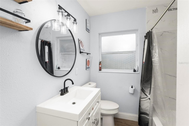 full bath with a shower with shower curtain, toilet, vanity, wood finished floors, and baseboards