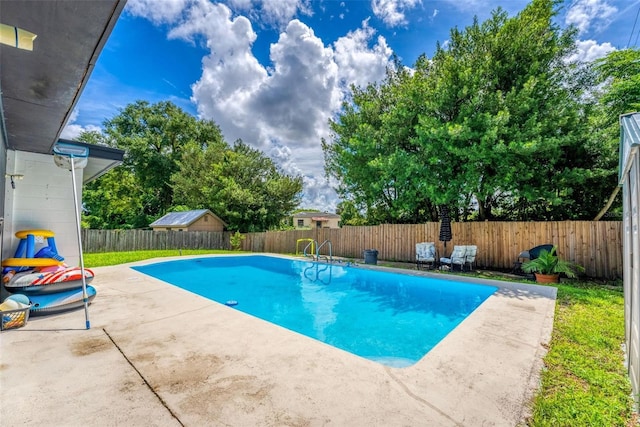 view of swimming pool with a patio area, a fenced backyard, and a fenced in pool