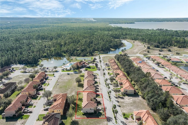 birds eye view of property with a residential view, a water view, and a forest view