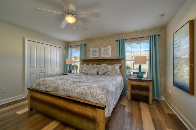 bedroom featuring a closet, baseboards, and wood finished floors