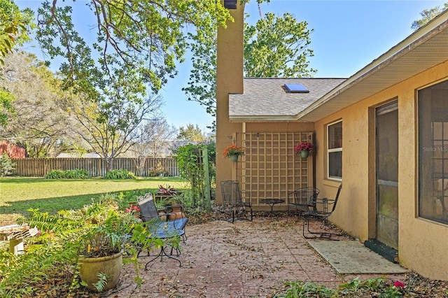 view of patio featuring fence