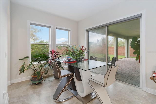 dining area featuring baseboards