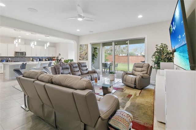 living room with recessed lighting and ceiling fan