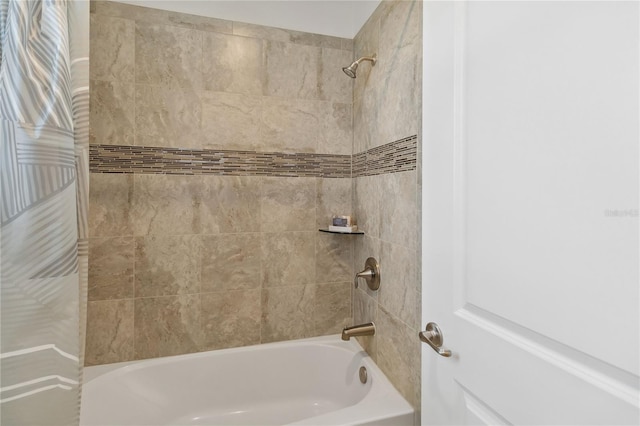 bathroom with shower / washtub combination