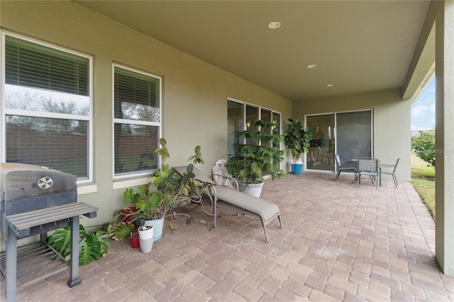 view of patio featuring outdoor dining space and grilling area