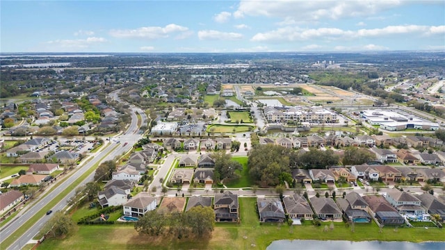 birds eye view of property with a residential view