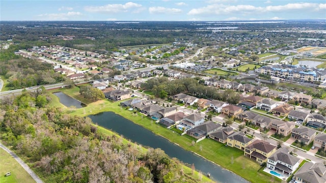 birds eye view of property with a residential view and a water view