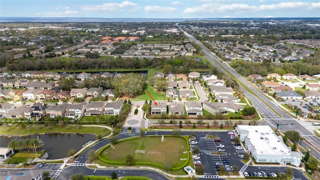 bird's eye view with a water view and a residential view