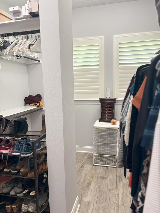 spacious closet with wood finished floors