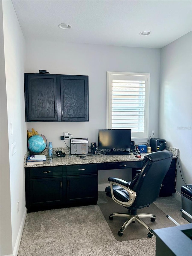 home office with light carpet and baseboards