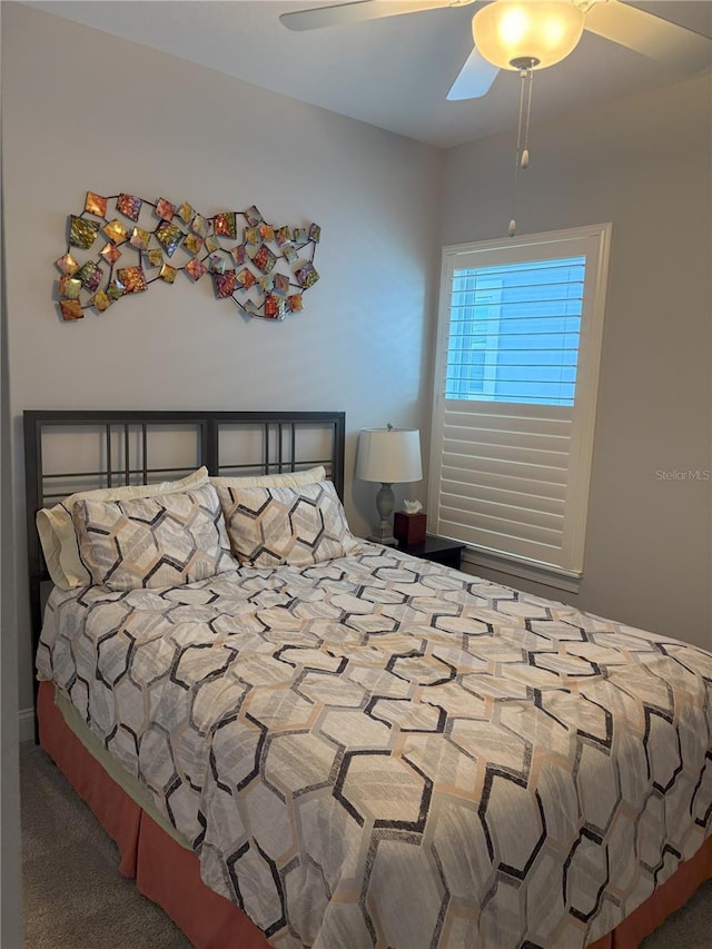 carpeted bedroom featuring a ceiling fan