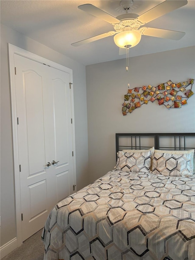 bedroom featuring carpet floors and a ceiling fan