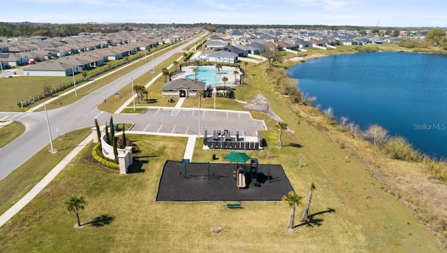 birds eye view of property featuring a residential view and a water view