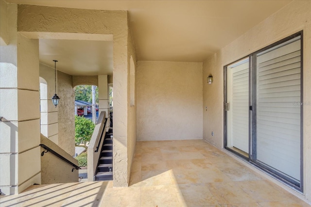 view of patio featuring a balcony