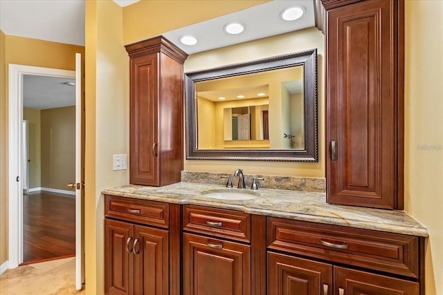 bathroom with tile patterned flooring and vanity