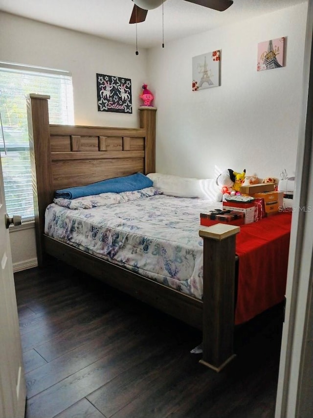 bedroom featuring hardwood / wood-style flooring and a ceiling fan