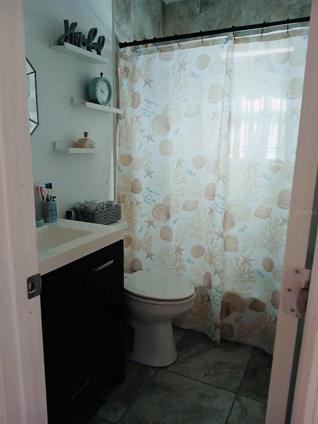 full bath with toilet, tile patterned floors, a shower with shower curtain, and vanity