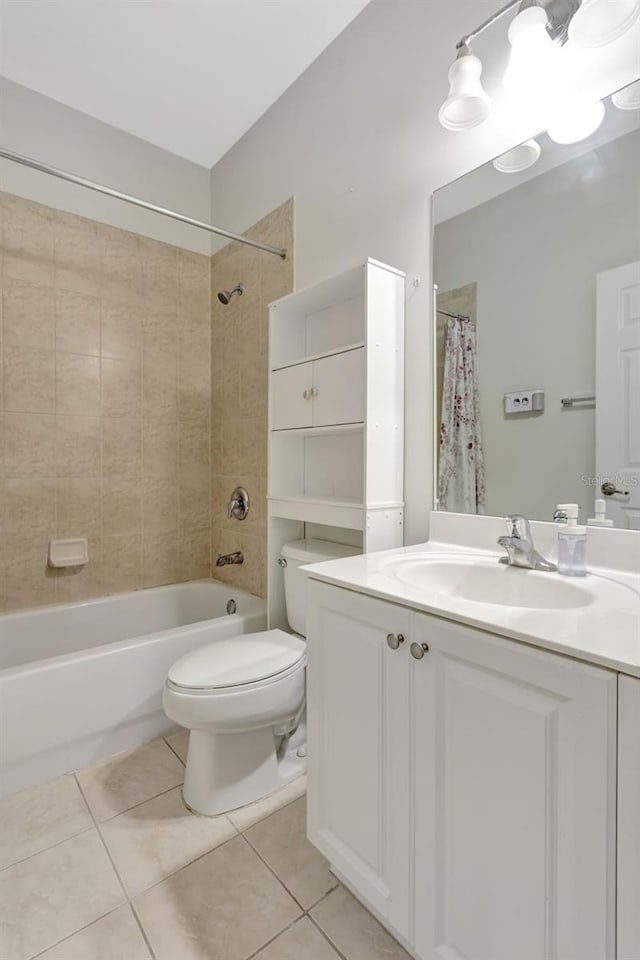 full bath featuring toilet, shower / bathtub combination, vanity, and tile patterned floors