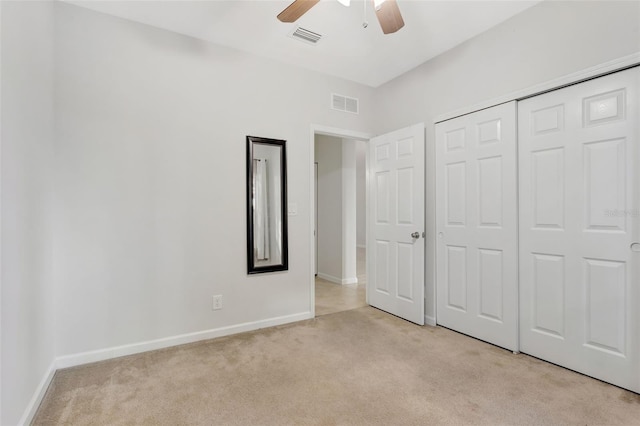 unfurnished bedroom with light carpet, baseboards, and visible vents