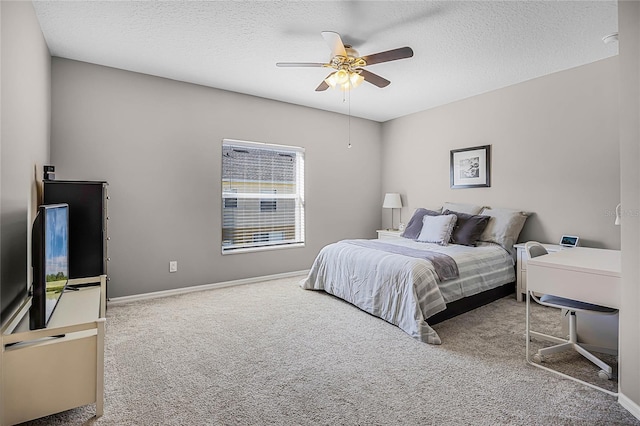 bedroom featuring carpet flooring, ceiling fan, a textured ceiling, and baseboards