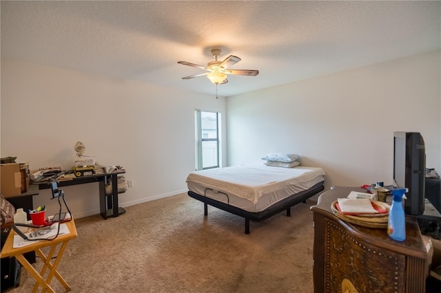 bedroom with light carpet, ceiling fan, a textured ceiling, and baseboards