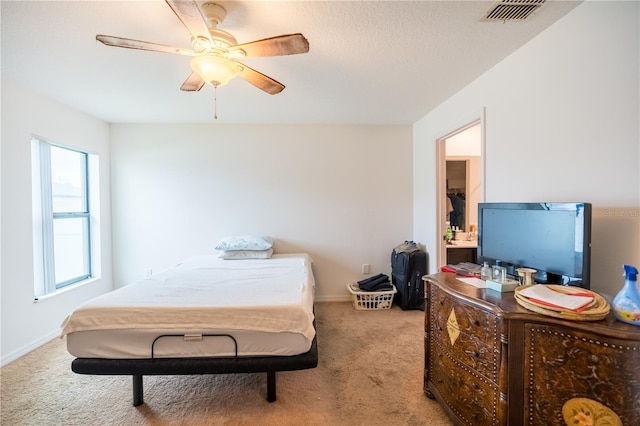 bedroom featuring a ceiling fan, baseboards, visible vents, and carpet flooring