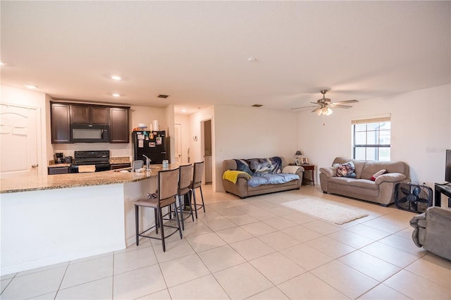 living room featuring light tile patterned floors, visible vents, a ceiling fan, and recessed lighting