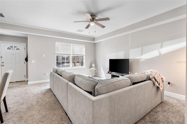 living room with ornamental molding, light carpet, visible vents, and baseboards