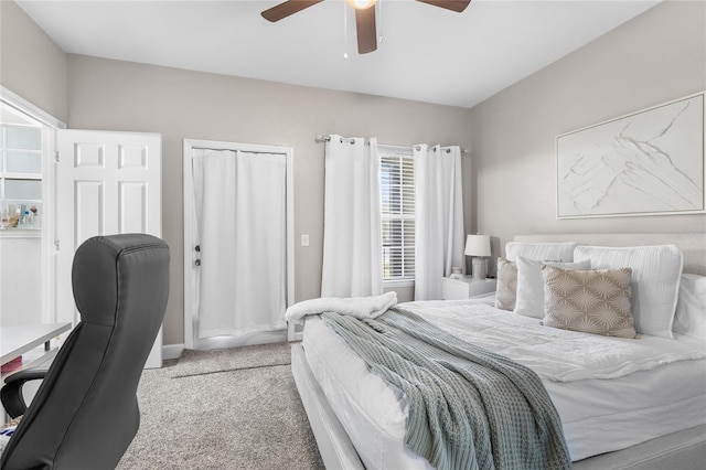 carpeted bedroom featuring a ceiling fan and a closet