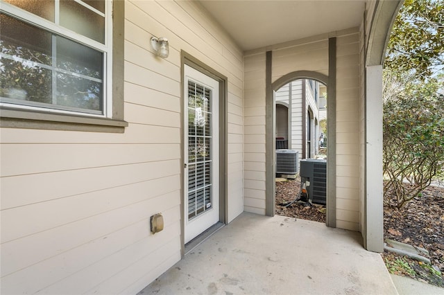 entrance to property featuring central air condition unit